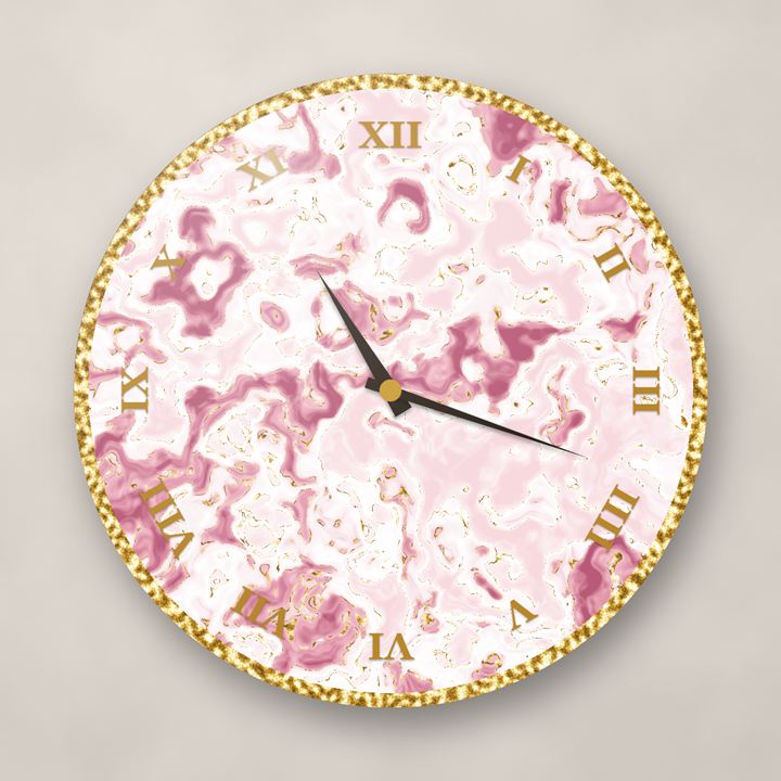A round resin wall clock in white and rose marble with gold veins, gold Roman numerals and dark hands